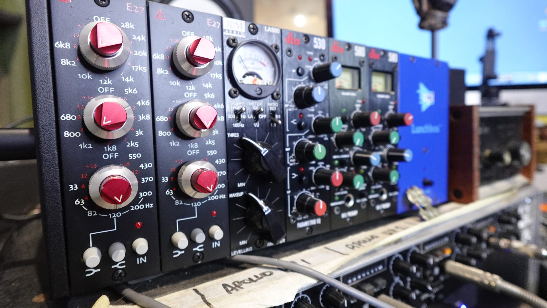 A rack of professional outboard recording gear in a mixing studio