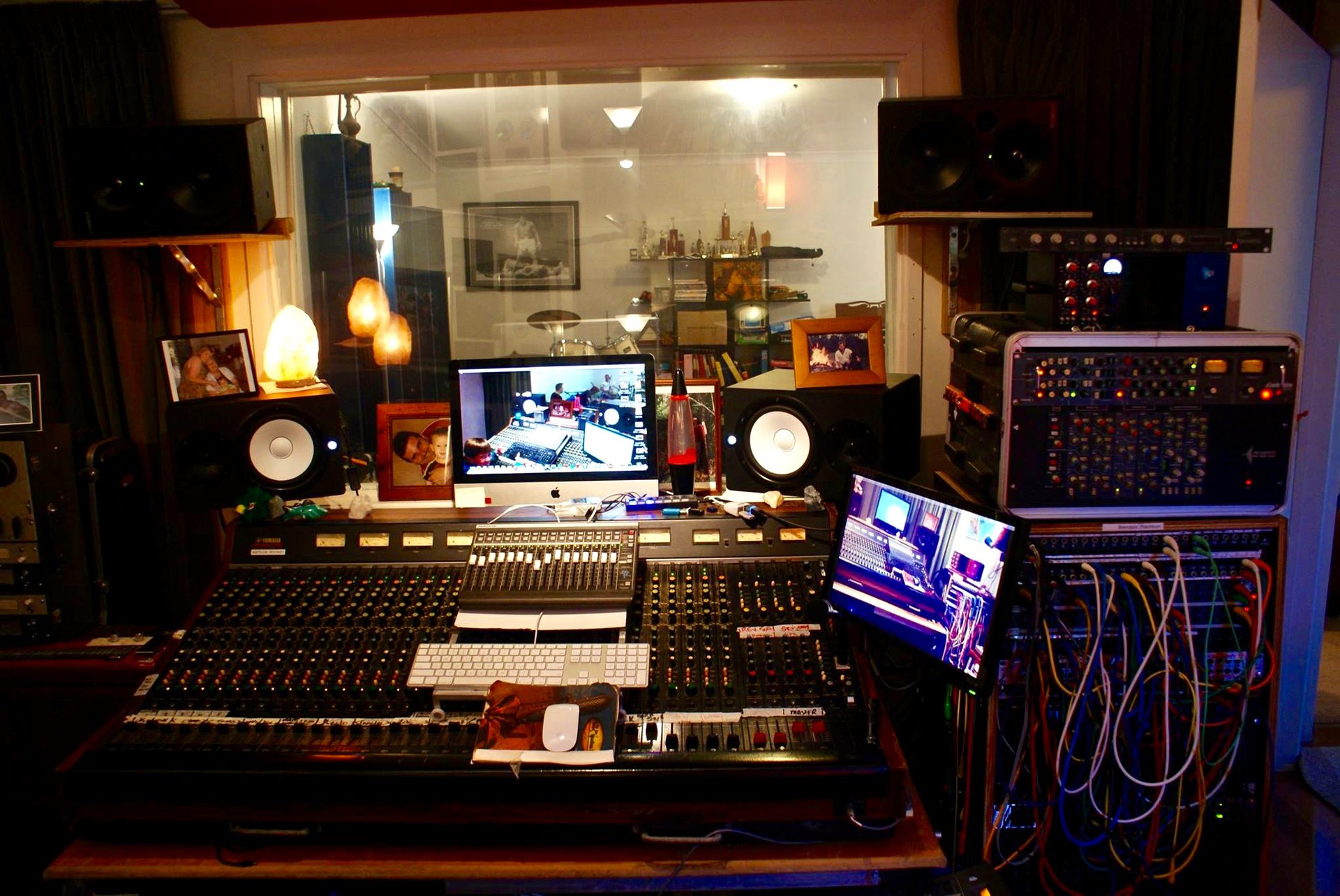 A musician working alone in a home studio, discovering their own musical voice